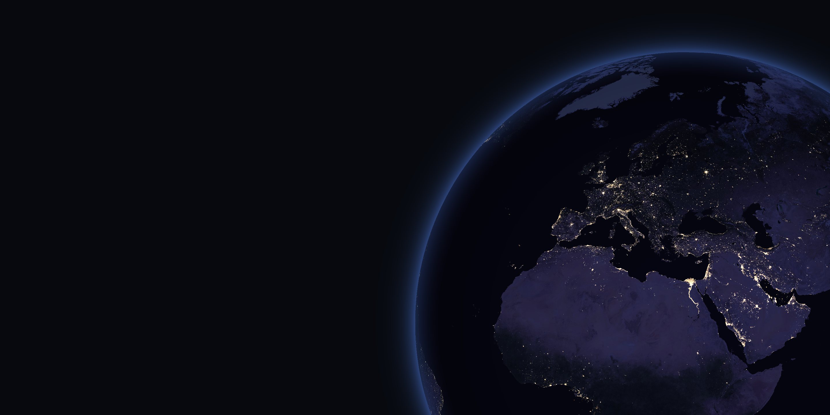 Night view of Earth centred on Europe, showing city lights